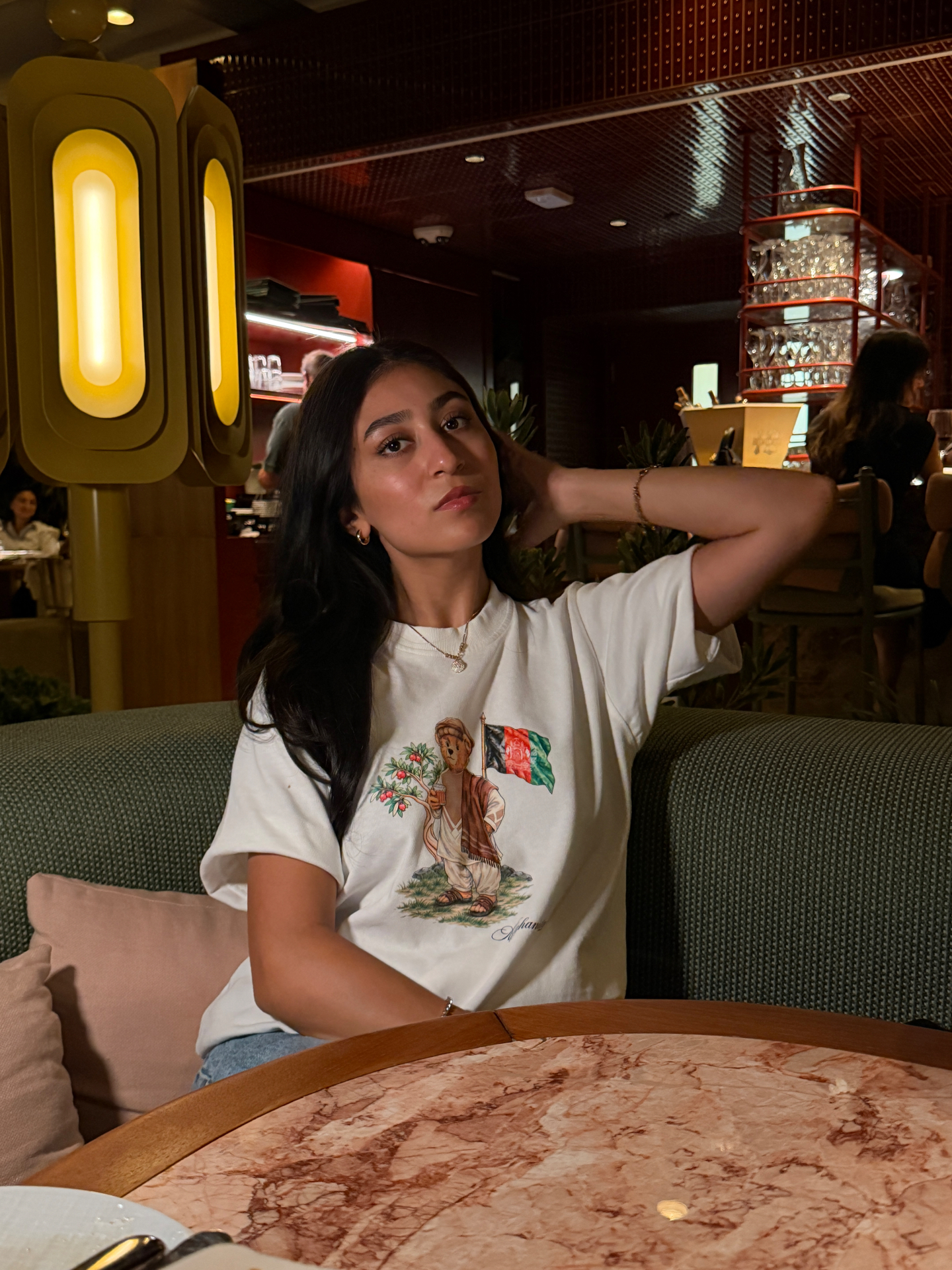 Project Paradise tee at the marble table